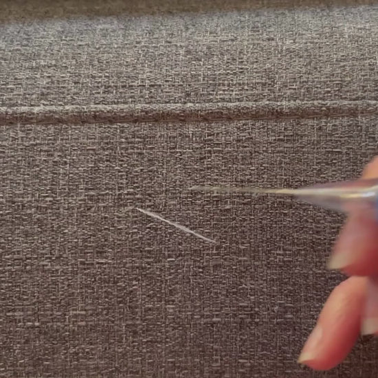 Video demonstrating how to use a Fabric Fix Stick tool to fix pulls in fabric furniture caused by cats.