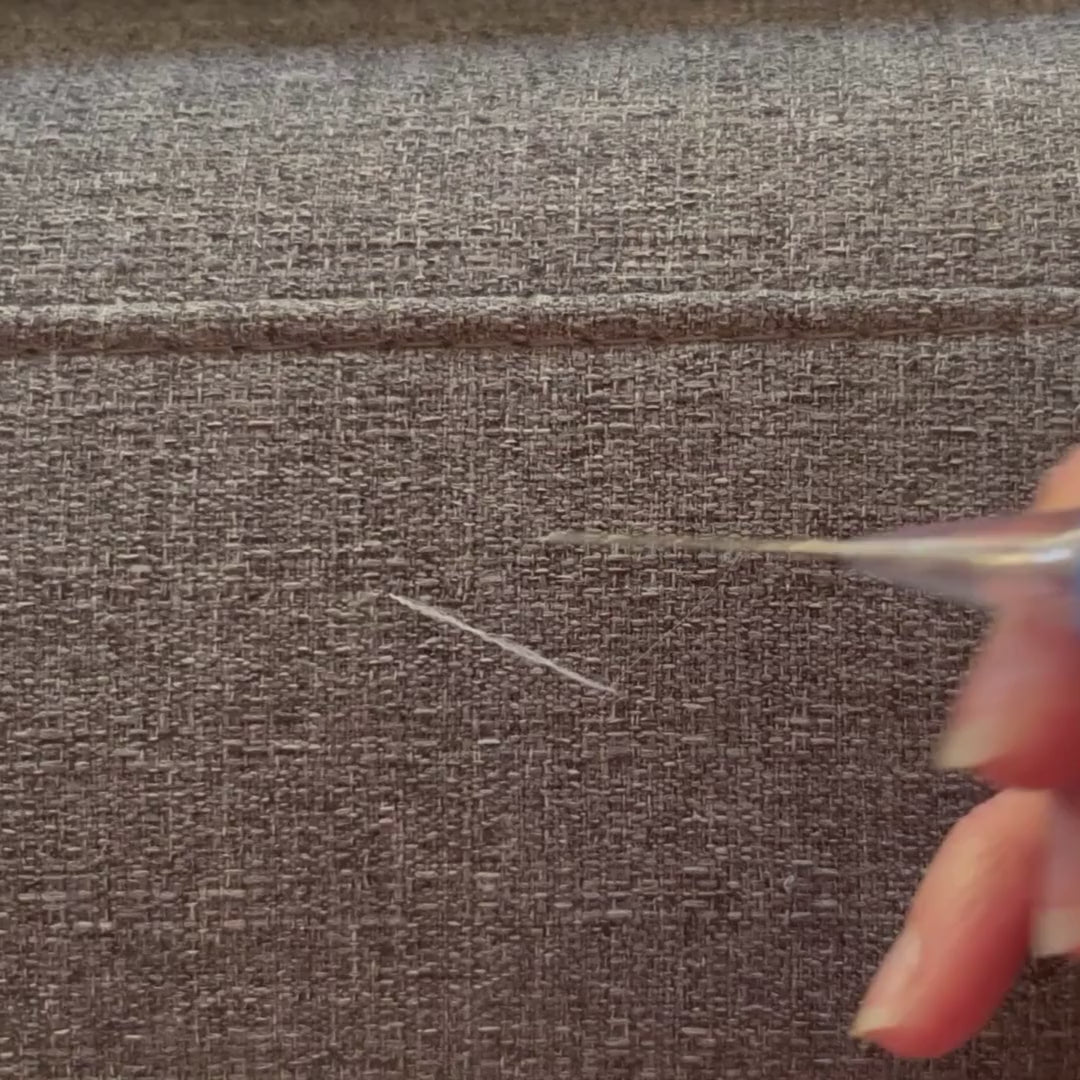 Video demonstrating how to use a Fabric Fix Stick tool to fix pulls in fabric furniture caused by cats.